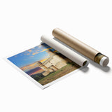 Rolled print of a stunning landscape featuring a majestic castle surrounded by lush green hills under a bright blue sky. Ideal for home decor or art collectors.