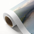 Rolled canvas showcasing a vibrant landscape featuring a majestic castle surrounded by lush greenery and a clear blue sky, ideal for home decor or art collection.
