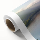 Rolled canvas showcasing a vibrant landscape featuring a majestic castle surrounded by lush greenery and a clear blue sky, ideal for home decor or art collection.