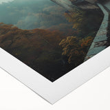 Rolled canvas artwork showcasing a vibrant landscape with a majestic castle set against a dramatic sky, ideal for home decor and art enthusiasts.