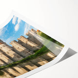 Rolled print showcasing a picturesque landscape of a medieval castle surrounded by lush greenery, designed for wall art collection. Perfect for home decor enthusiasts.