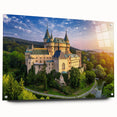 Acrylic glass wall art collection showcasing a detailed landscape of a castle, displayed in a modern setting with pins for hanging, emphasizing vibrant colors and intricate design.