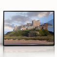 Framed acrylic wall art featuring a stunning landscape with a castle, set against a vibrant sky, ideal for home decor enthusiasts. The sleek black frame enhances the artistic details, making it a captivating centerpiece for any room.