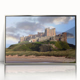 Framed wall art featuring a striking landscape and castle design, presented in an elegant silver frame, ideal for home decor and enhancing interior aesthetics.