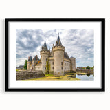 Framed wall art collection showcasing a stunning landscape of a castle, presented in a sleek black frame with matting, ideal for home decor enthusiasts.