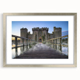 Framed wall art collection featuring a picturesque landscape of castles, elegantly showcased in a silver frame with a mat, ideal for enhancing home decor.