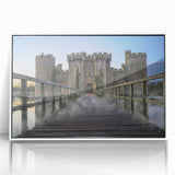 Framed acrylic wall art showcasing a scenic landscape with a castle, highlighted by a white frame, perfect for home decor enthusiasts seeking elegant designs.