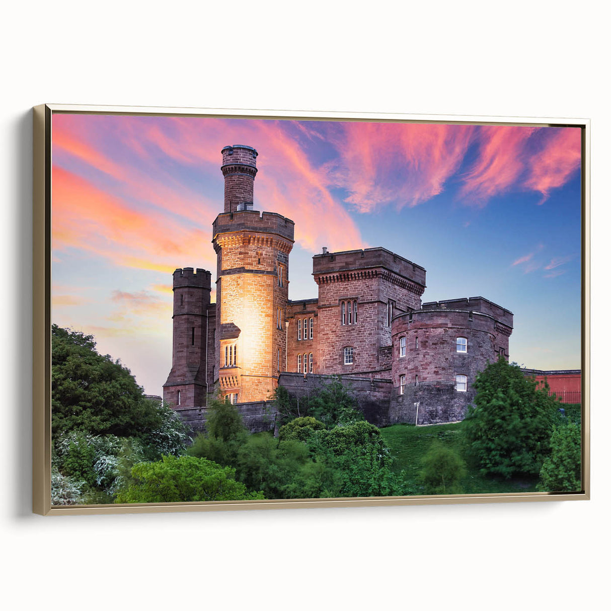 Framed canvas wall art showcasing a scenic landscape with a majestic castle, highlighted by gold accents, perfect for enhancing home decor. The artwork features vibrant colors, intricate details, and a side view emphasizing the elegant framing, making it an ideal centerpiece for any room.