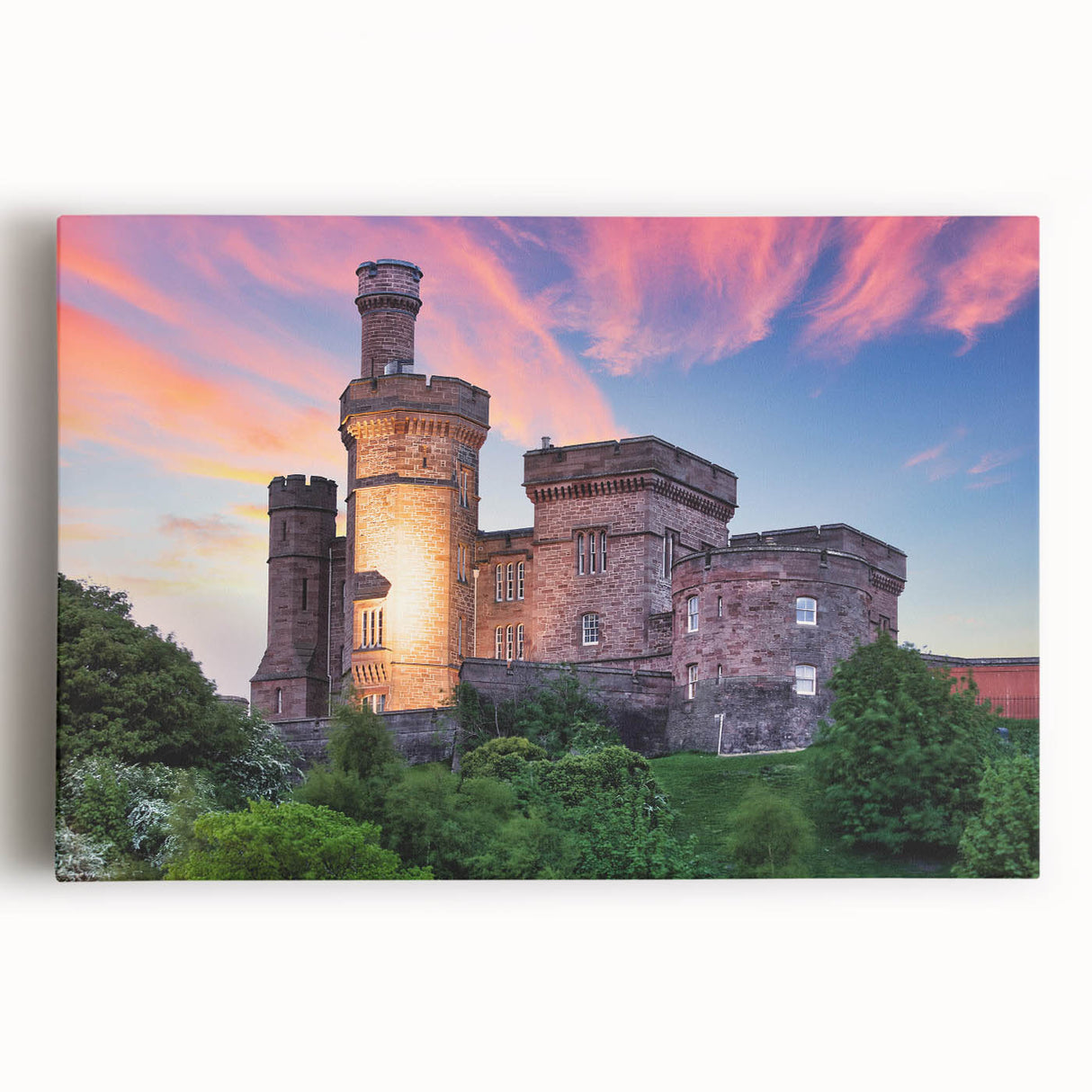 Stretched canvas artwork showcasing a vibrant landscape of a medieval castle, surrounded by lush greenery and a clear blue sky, perfect for home decor.
