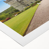 Rolled canvas artwork showcasing a stunning landscape with a majestic castle against a vibrant sunset, ideal for home decor and interior design enthusiasts.