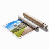 Rolled print showcasing a stunning castle landscape design, featuring vibrant colors and intricate details, elegantly packaged in a protective cardboard tube for easy display.