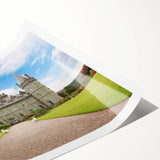 Stunning rolled print of a vibrant landscape featuring a majestic castle set against rolling hills and a blue sky, ideal for home decor enthusiasts.