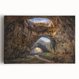 Stretched canvas wall art showcasing a vibrant landscape scene with intricate cave designs, ideal for home decor. Perfect for adding a touch of nature-inspired elegance to any room.
