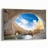 Framed canvas wall art showcasing a serene landscape with intricate cave designs, featuring a silver frame that enhances its elegance, perfect for home decor.