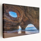 Stretched canvas wall art featuring vibrant abstract landscape design with deep blue and earthy tones, showcasing a side view of the artwork's texture and depth.