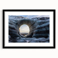 Framed wall art featuring a stunning landscape design with cave motifs, presented in a sleek black frame and a white mat, ideal for modern home decor.