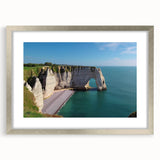 Framed landscape wall art depicting majestic cliffs with a silver mat, perfect for home decor, showcasing natural beauty and elegance in modern interiors.