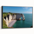 Framed canvas wall art showcasing a dramatic cliff landscape in vibrant colors, featuring black framing for a modern touch, ideal for home decor.