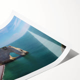 Rolled print showcasing a vibrant landscape of cliffs at sunset, featuring warm oranges and cool blues, designed for wall art décor. Ideal for nature enthusiasts.