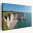 Stretched canvas artwork showcasing a vibrant landscape of rugged cliffs and serene ocean waves, ideal for modern home decor. Perfect for adding nature-inspired elegance to any room.