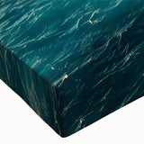 Close-up of a stretched canvas wall art piece showcasing a vibrant landscape of rugged cliffs, with rich colors and intricate details, perfect for home decor.