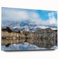 Side view of an acrylic glass wall art piece showcasing a stunning landscape of cliffs, elegantly displayed with pins on a minimalist background, adding a modern touch to any decor.