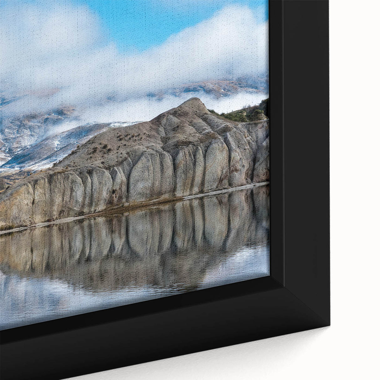 Framed canvas wall art depicting a vibrant landscape of majestic cliffs, showcasing rich colors and intricate details, ideal for home decor enhancement.