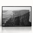 Framed acrylic wall art featuring a stunning landscape of rugged cliffs, designed in a modern style with a sleek black frame, perfect for enhancing home decor.