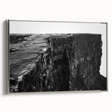 Framed canvas wall art showcasing a stunning landscape with dramatic cliffs in silver tones, enhancing modern decor with its elegant design and vivid colors.