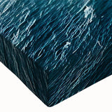 Close-up of a stretched canvas wall art piece showcasing vibrant landscapes and dramatic cliffs, emphasizing rich colors and intricate details, perfect for modern decor.