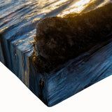 Close-up of a stretched canvas wall art piece showcasing a vibrant landscape of cliffs at sunset, featuring rich colors and detailed textures, perfect for home decor.