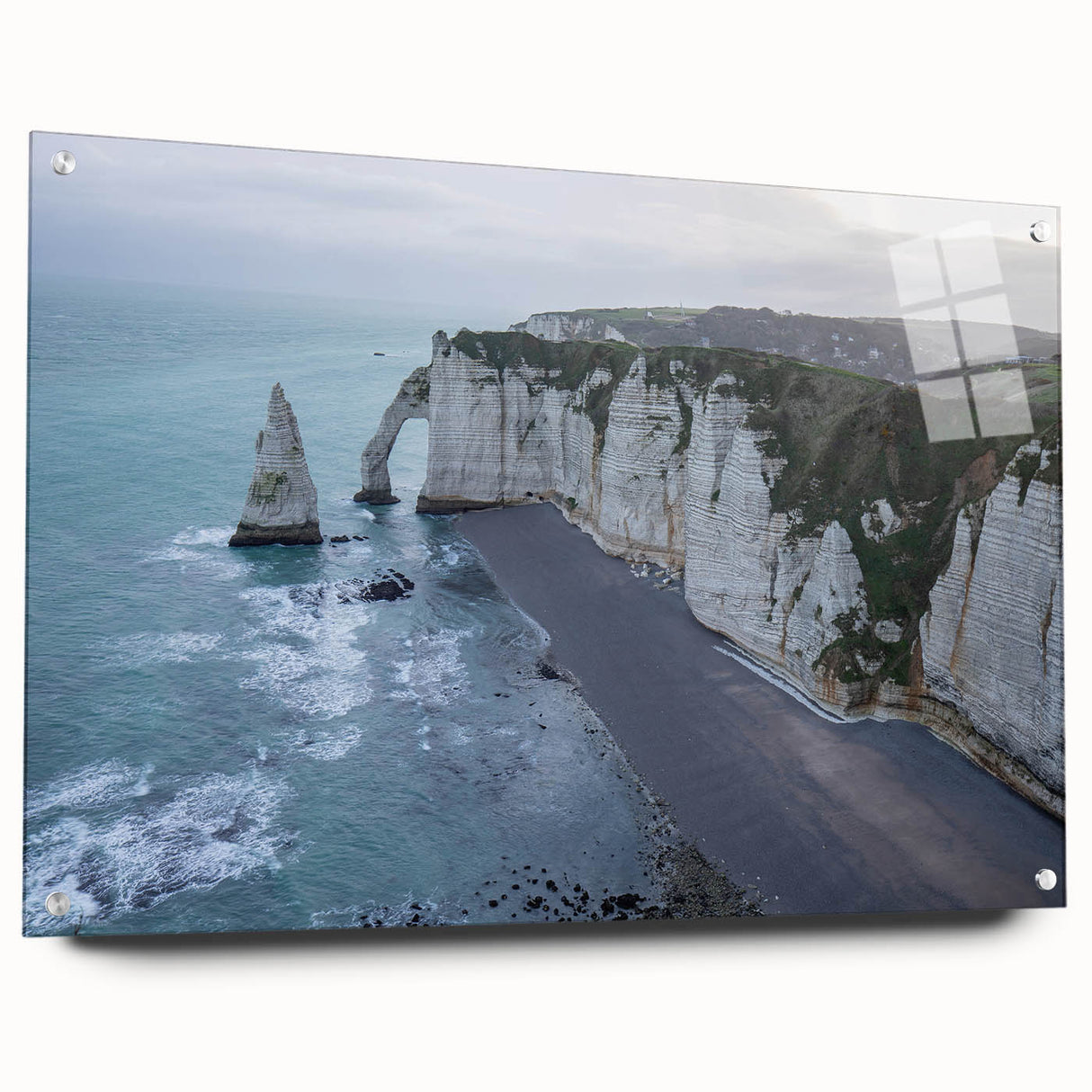 Acrylic wall art piece showcasing a vibrant landscape design featuring cliffs, displayed in a sleek, modern setting with decorative pins holding it in place. This design adds a contemporary touch to any interior space.
