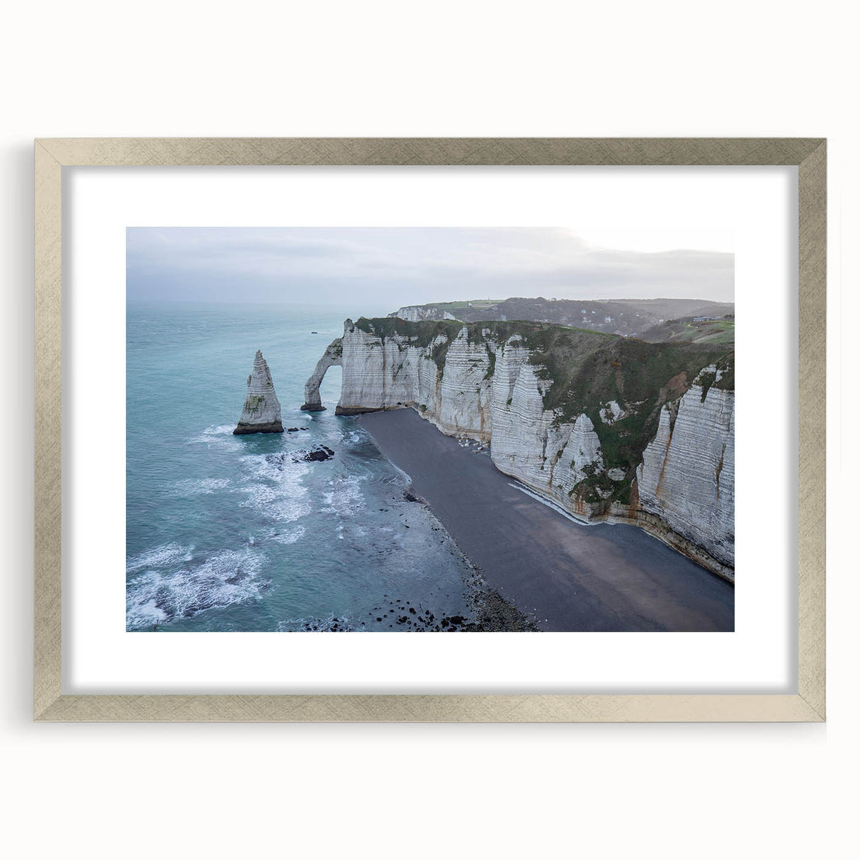 Framed wall art featuring a serene landscape of cliffs, showcased in a silver frame with a mat. Ideal for enhancing home decor with natural beauty.