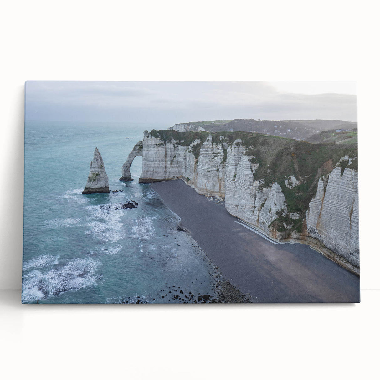Stretched canvas wall art showcasing a vibrant landscape of cliffs and ocean waves, designed for modern home decor, adding a serene touch to any room.