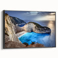Framed canvas wall art showcasing a dramatic cliff landscape in muted earth tones, set against a sleek black frame, perfect for modern home decor.
