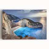 Stretched canvas wall art showcasing a vibrant landscape of cliffs at sunset, featuring rich hues of orange and purple, ideal for modern home decor.