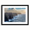 Framed black wall art showcasing a stunning landscape of cliffs, featuring vibrant colors and intricate details, perfect for modern home decor.