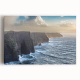 Stretched canvas wall art showcasing a vibrant landscape of rugged cliffs against a clear blue sky, perfect for home decor and nature-inspired themes.