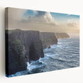 Stretched canvas wall art showcasing a vibrant landscape of cliffs with a stunning sunset, ideal for modern home decor, adding warmth and color to any room.