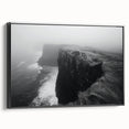 Framed canvas wall art depicting a vibrant landscape with cliffs and a sunset, featuring rich colors of orange and blue, perfect for modern home decor.