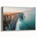 Framed canvas wall art showcasing a serene landscape with cliffs and vibrant colors, perfect for modern home decor. Silver frame adds elegance to any room.