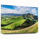 Acrylic glass wall art featuring a vibrant countryside landscape design, showcasing lush green fields and a bright blue sky, elegantly displayed from a side view with decorative pins.