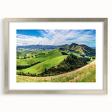 Framed wall art from the Landscapes Country Side Design collection, showcasing serene countryside scenery in soft colors, with a silver mat enhancing its elegance.