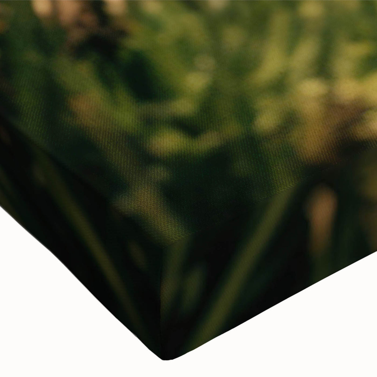 Close-up of a stretched canvas showcasing a vibrant country-side landscape design, featuring lush green fields and a serene sky, perfect for home decor.