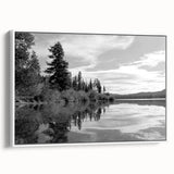 Framed canvas wall art depicting a serene countryside landscape design, showcasing vibrant greens and blues, with a white frame enhancing its elegant appeal. Perfect for home decor and nature enthusiasts.