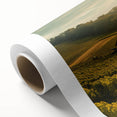 Rolled canvas artwork showcasing a serene countryside landscape with vibrant green hills and a clear blue sky, perfect for home decor. The design captures the tranquility of nature, making it an ideal centerpiece for any room.