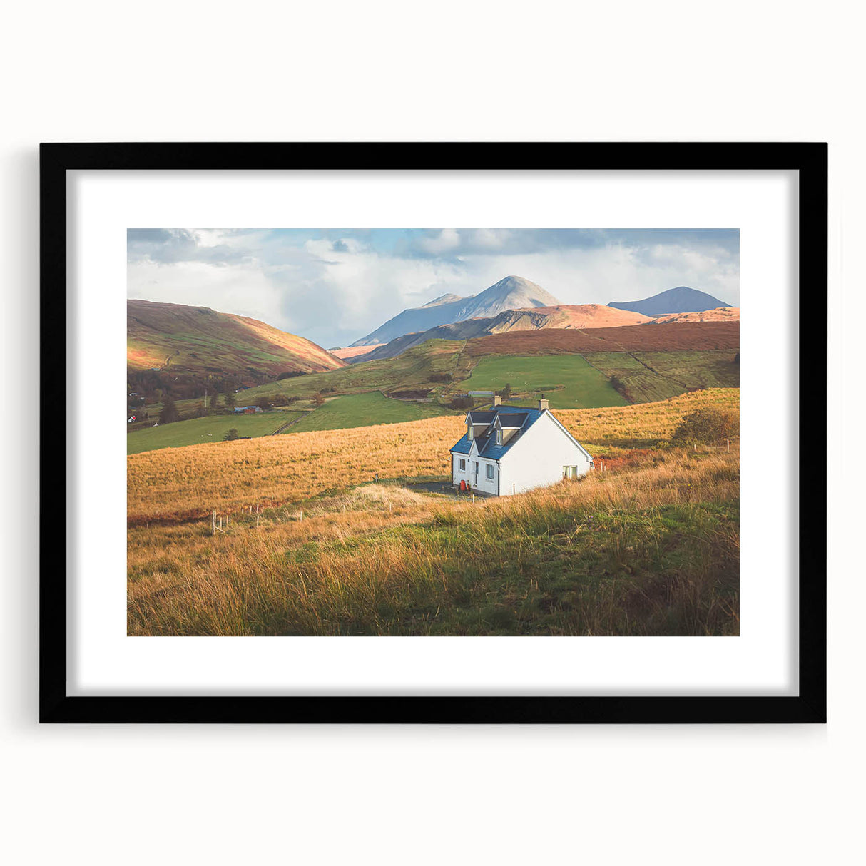 Framed wall art collection showcasing serene countryside landscapes in muted tones, featuring a sleek black frame with a white mat, ideal for home decor.