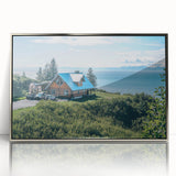 Framed acrylic wall art showcasing a serene countryside landscape with vibrant greens and soft blue skies, designed to enhance home decor.