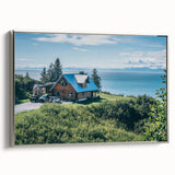 Framed canvas wall art showcasing a serene countryside landscape, featuring vibrant green fields and a tranquil blue sky, elegantly bordered in silver.