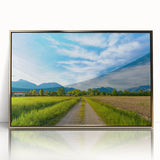 Framed acrylic wall art depicting a serene countryside landscape with golden accents, showcasing lush greenery and a tranquil atmosphere, perfect for home decor.